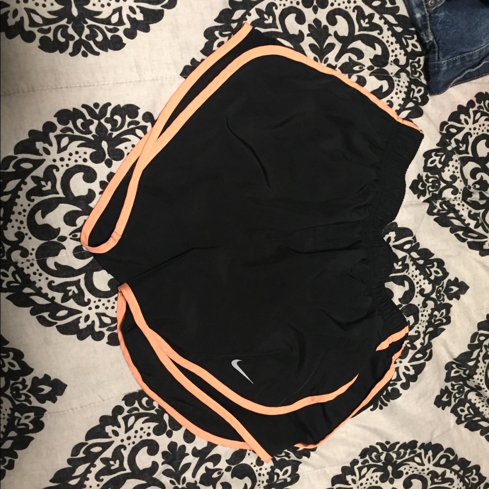 orange trimmed nike shorts